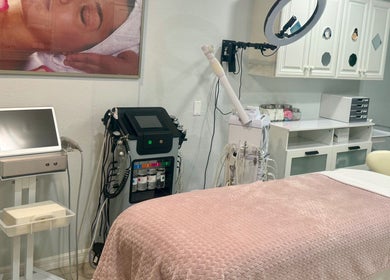 Modern treatment room at Inalvis Oasis Spa, Fort Myers, Florida, US with facial equipment and a relaxing vibe.