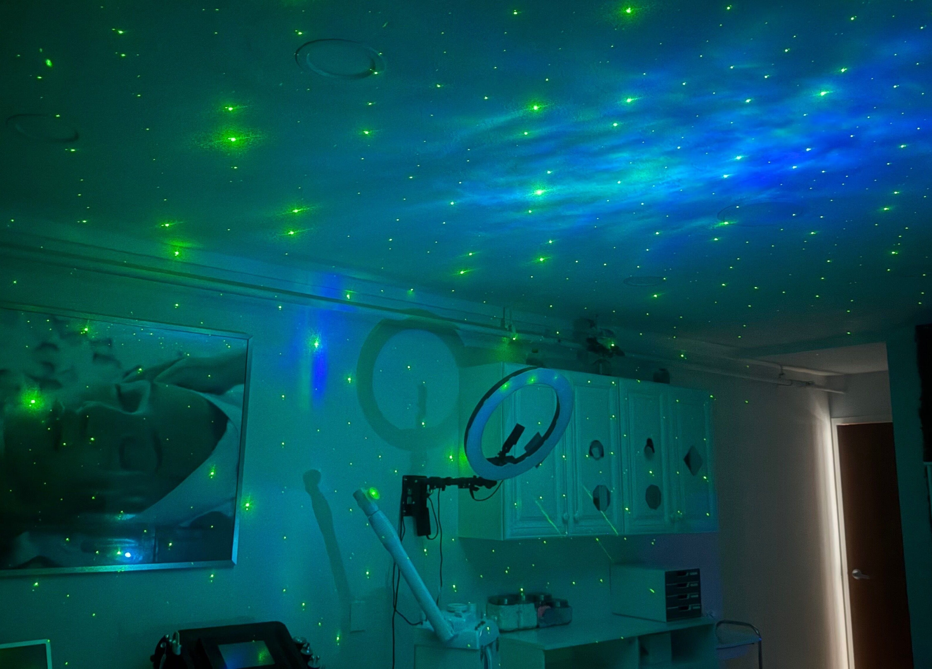 Relaxing cosmic-themed spa room at Inalvis Oasis Spa, Fort Myers, Florida, US with ambient lighting.