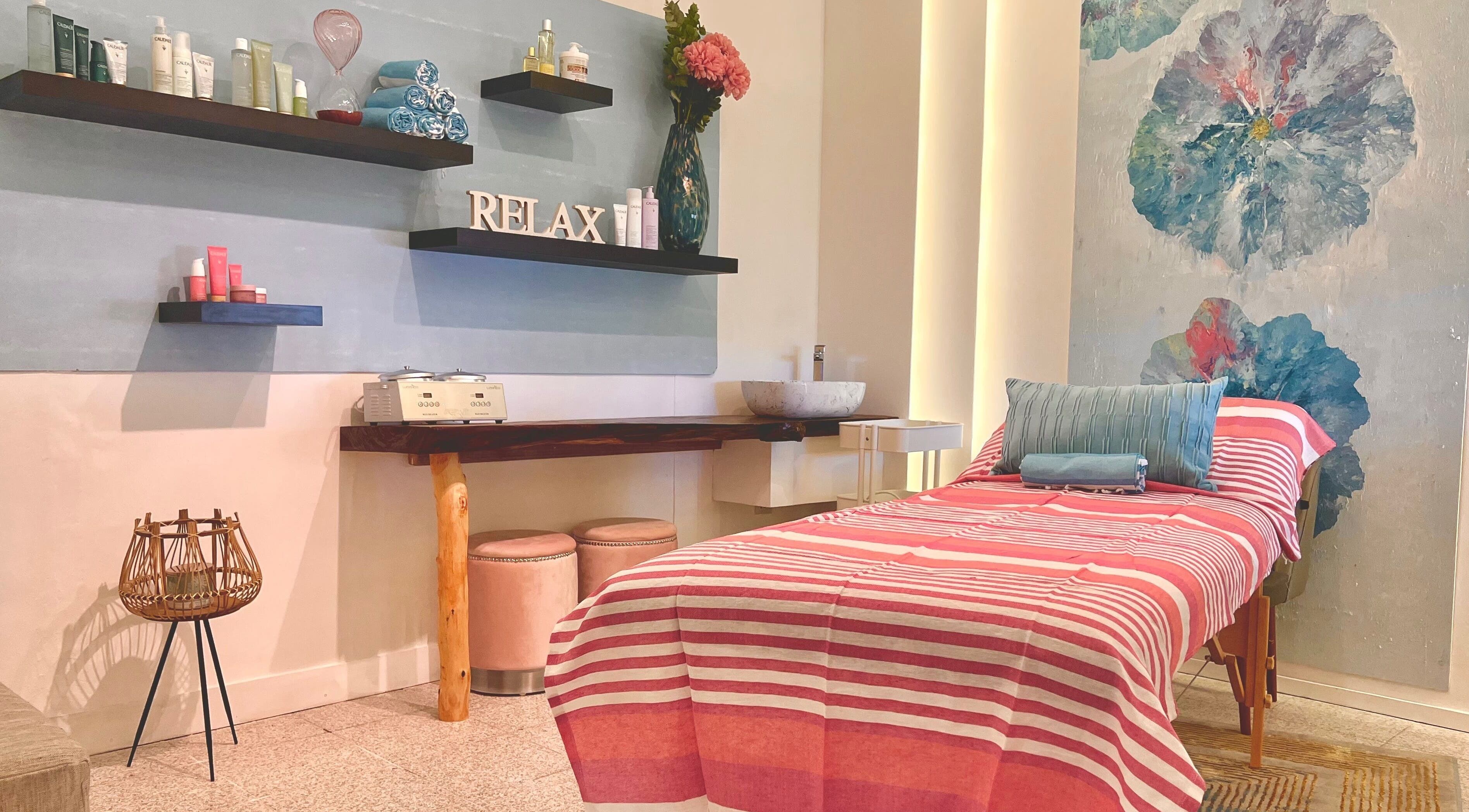 Inviting spa room at Perfect Pearl, Victoria, Mahe, SC with a cozy massage bed and relaxing decor.
