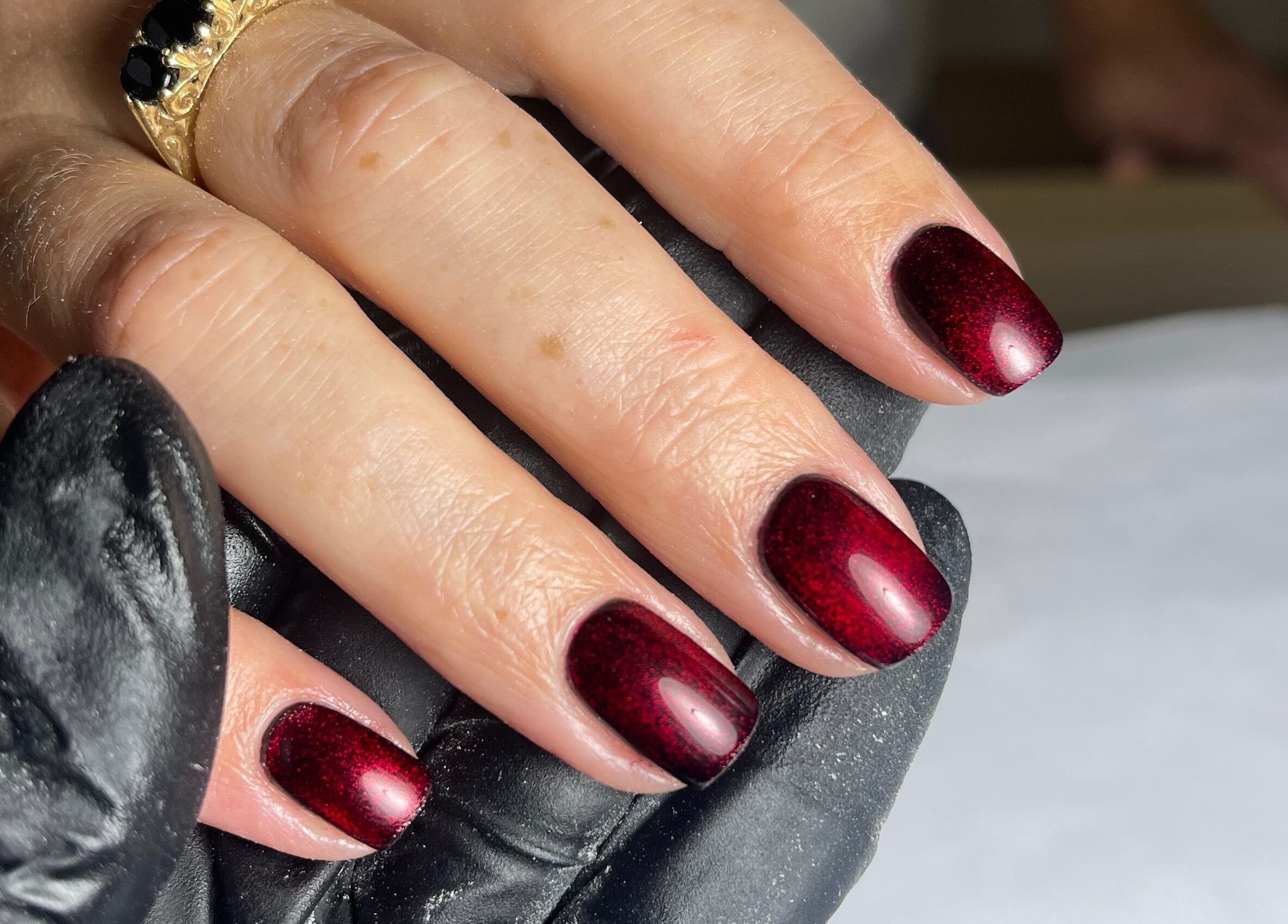 Elegant crimson manicured nails at Nails by Alexandrea, Bonnyrigg, Scotland, GB.