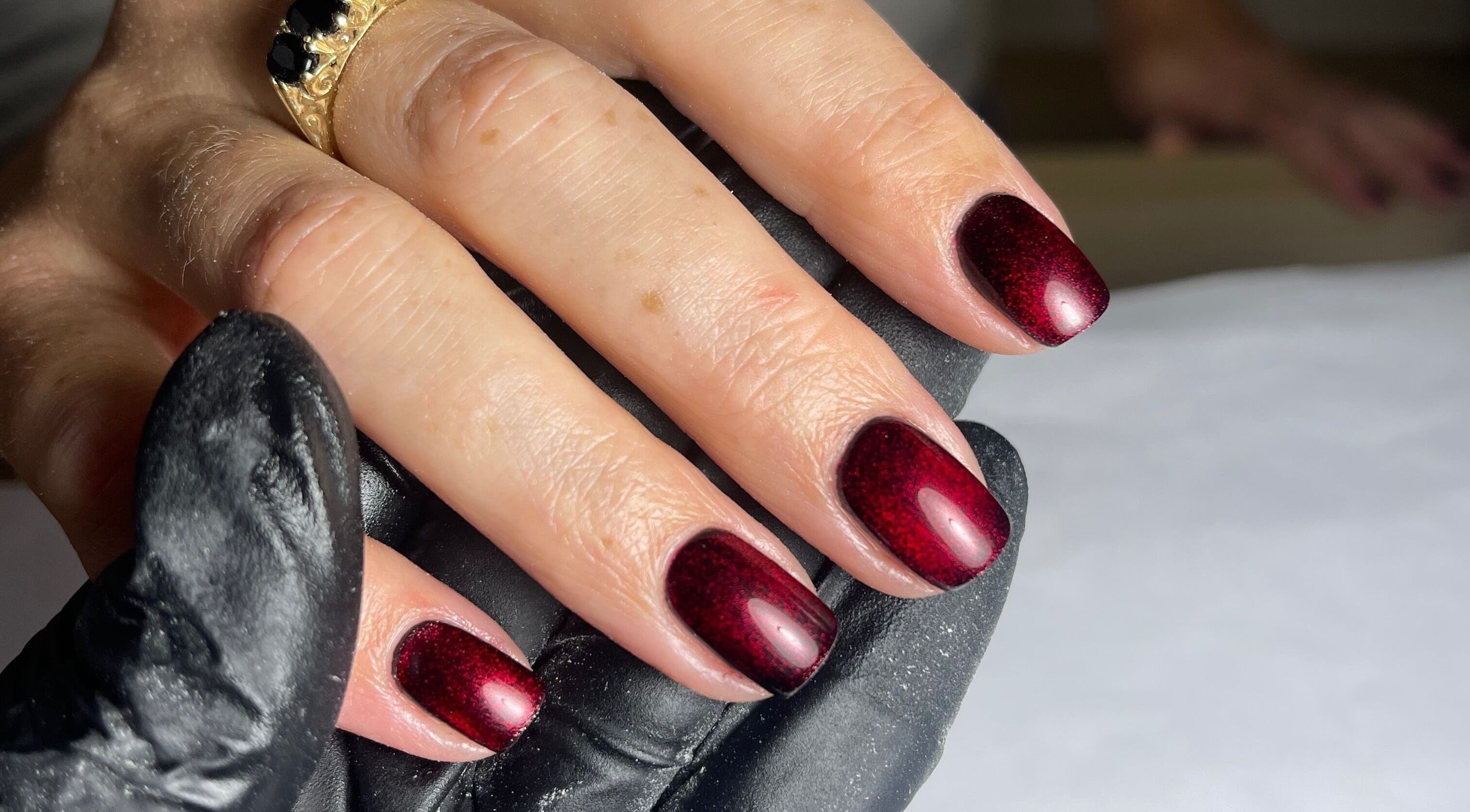 Elegant crimson manicured nails at Nails by Alexandrea, Bonnyrigg, Scotland, GB.