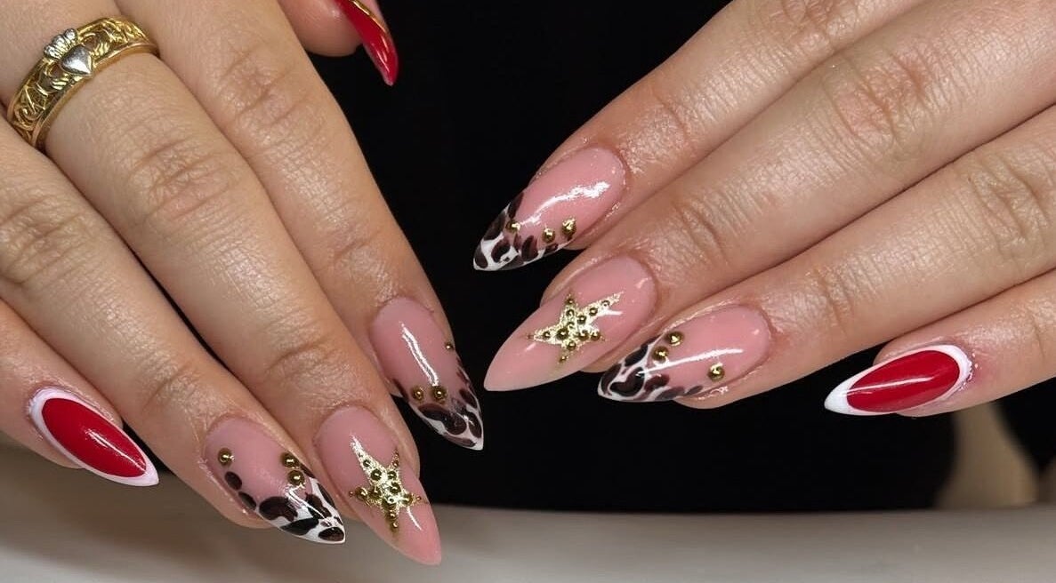 Elegant nail art at Lunar Lacquer, Dungarvan, County Waterford, IE features gold accents and vibrant colors.