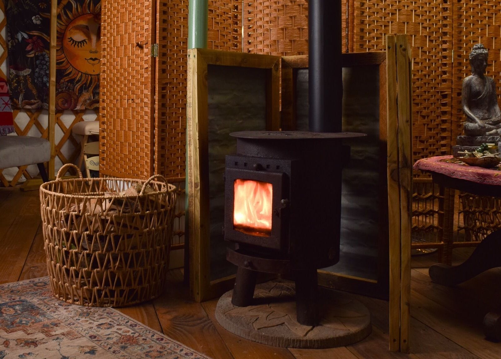 Warm and inviting interior at Wellness in the Wild, Newquay, England, GB featuring a wood-burning stove.
