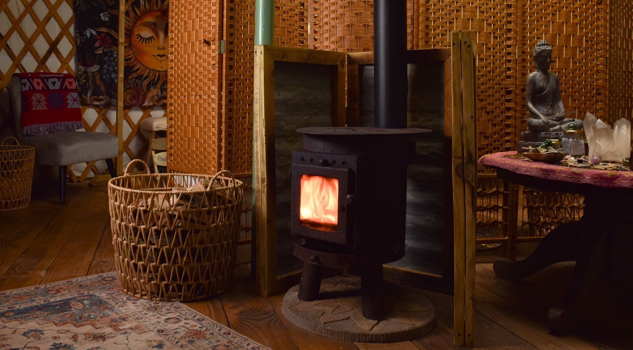 Warm and inviting interior at Wellness in the Wild, Newquay, England, GB featuring a wood-burning stove.