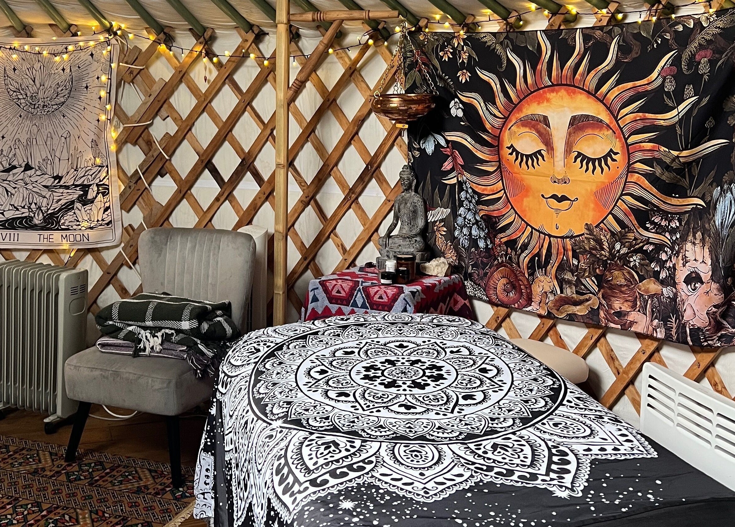 Cozy wellness retreat room at Wellness in the Wild, Newquay, England, GB with mystical decor and soft lighting.