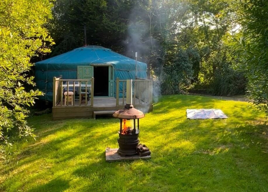 Escape to a serene yurt in lush greenery at Wellness in the Wild, Newquay, England, GB.