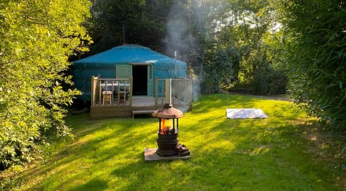Escape to a serene yurt in lush greenery at Wellness in the Wild, Newquay, England, GB.