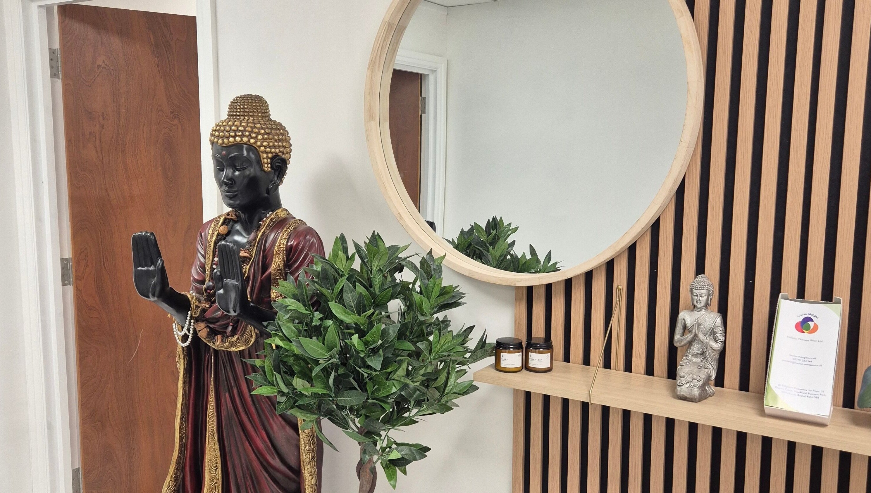 Peaceful Buddha statue and lush greenery at Louise Morgan Holistic Therapist in Bristol, England, GB.