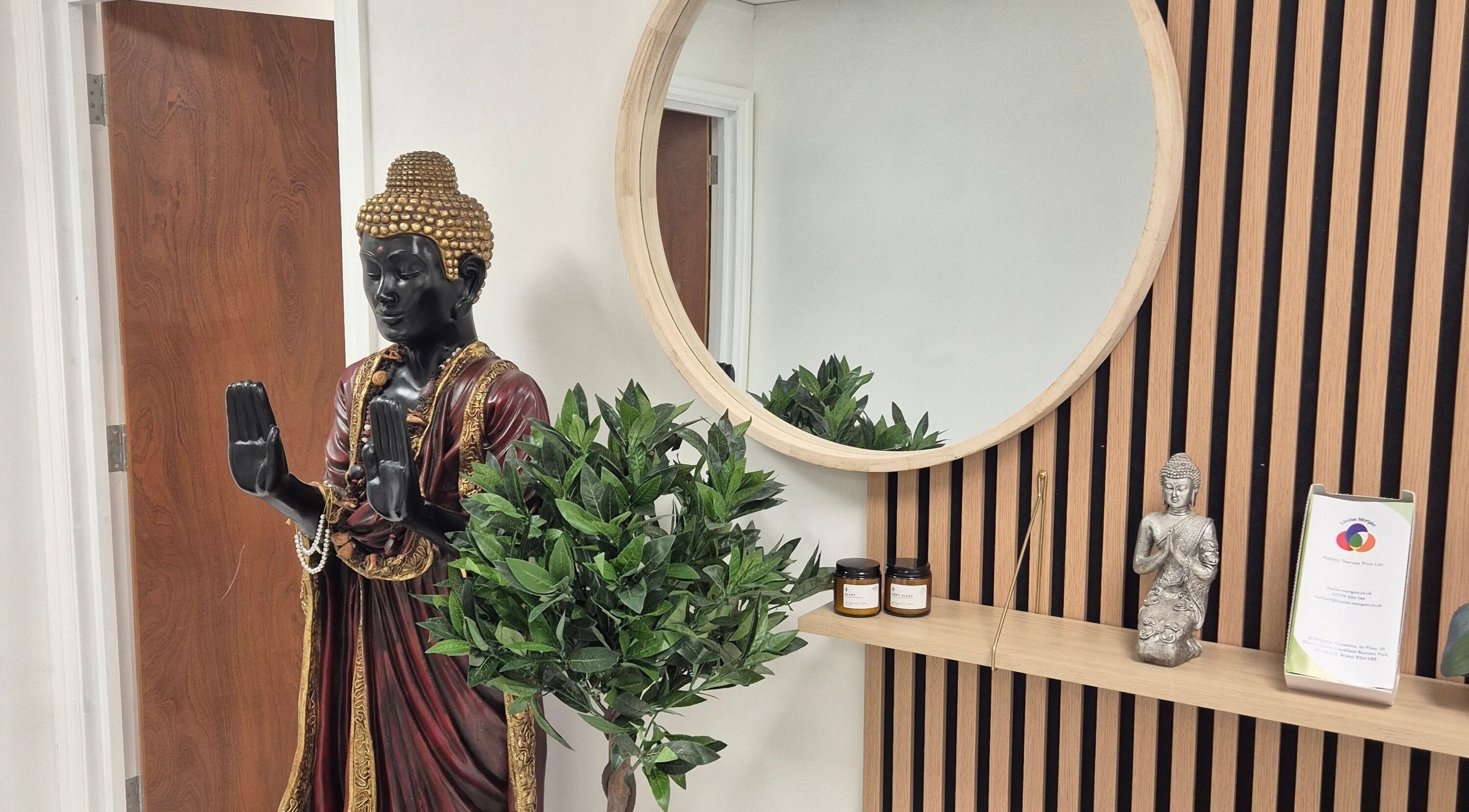 Peaceful Buddha statue and lush greenery at Louise Morgan Holistic Therapist in Bristol, England, GB.
