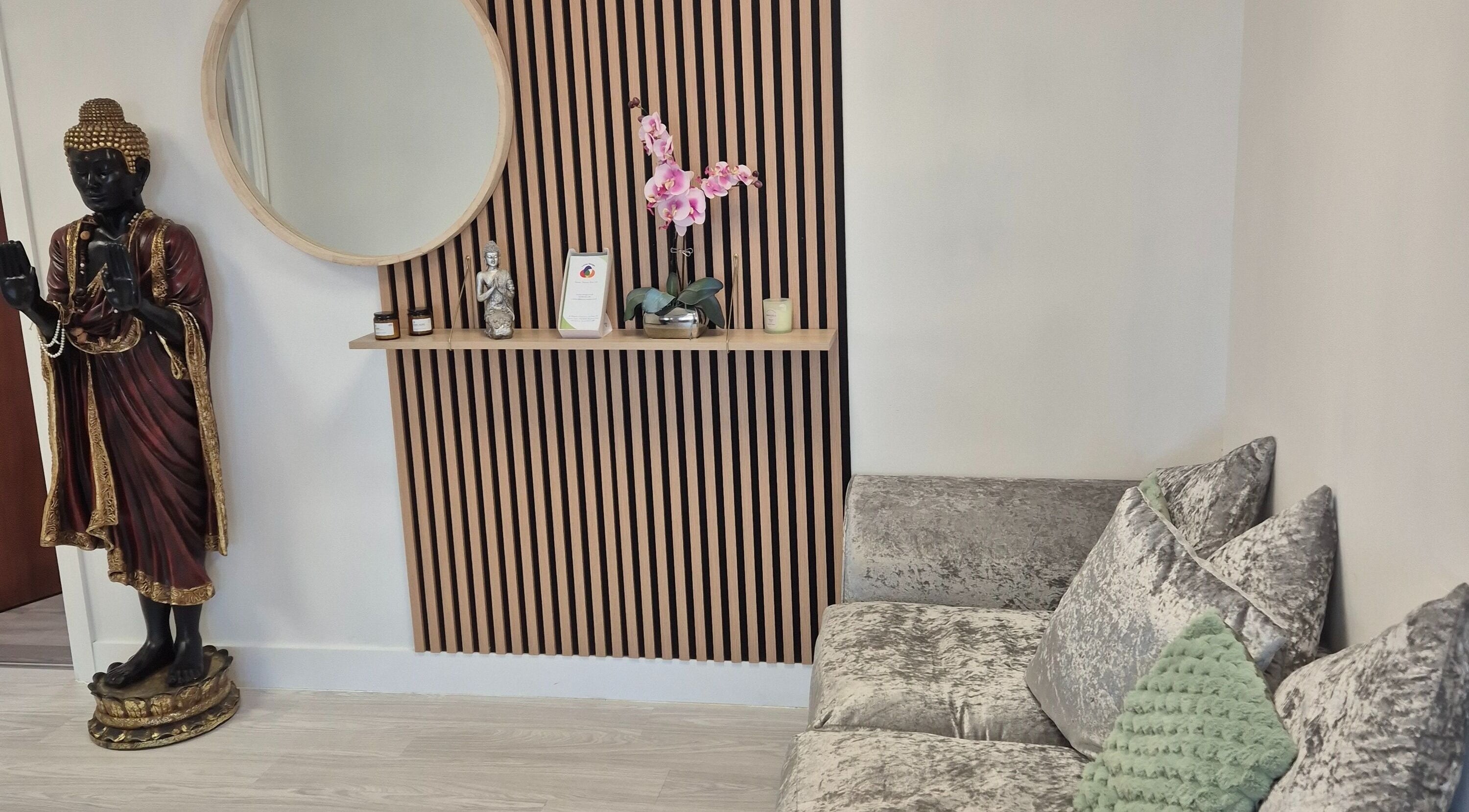 Louise Morgan Holistic Therapist's Bristol venue features a serene seating area with decor accents.