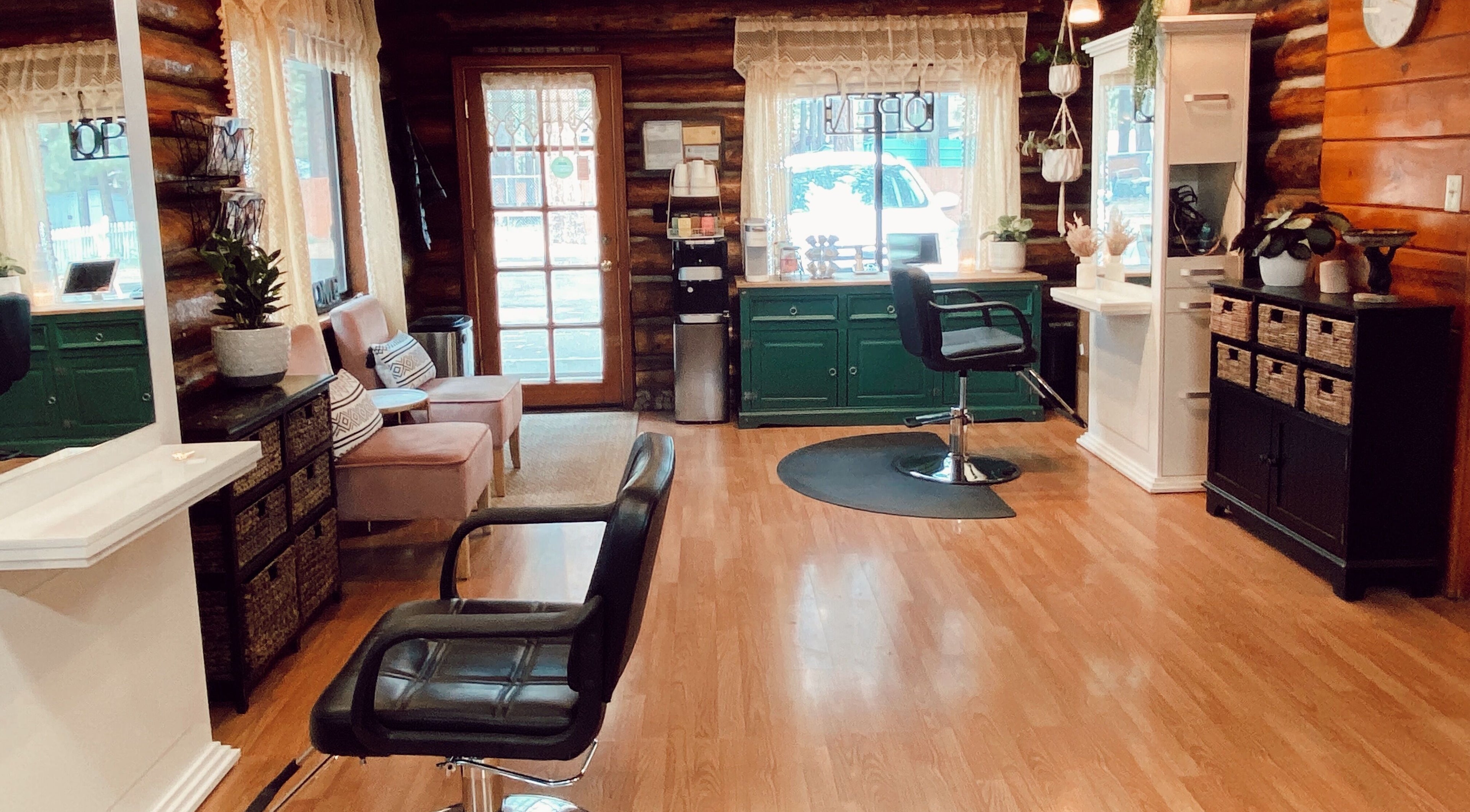 Cozy interior of Emerald Grove Salon in South Lake Tahoe, California, US, featuring elegant chairs and decor.