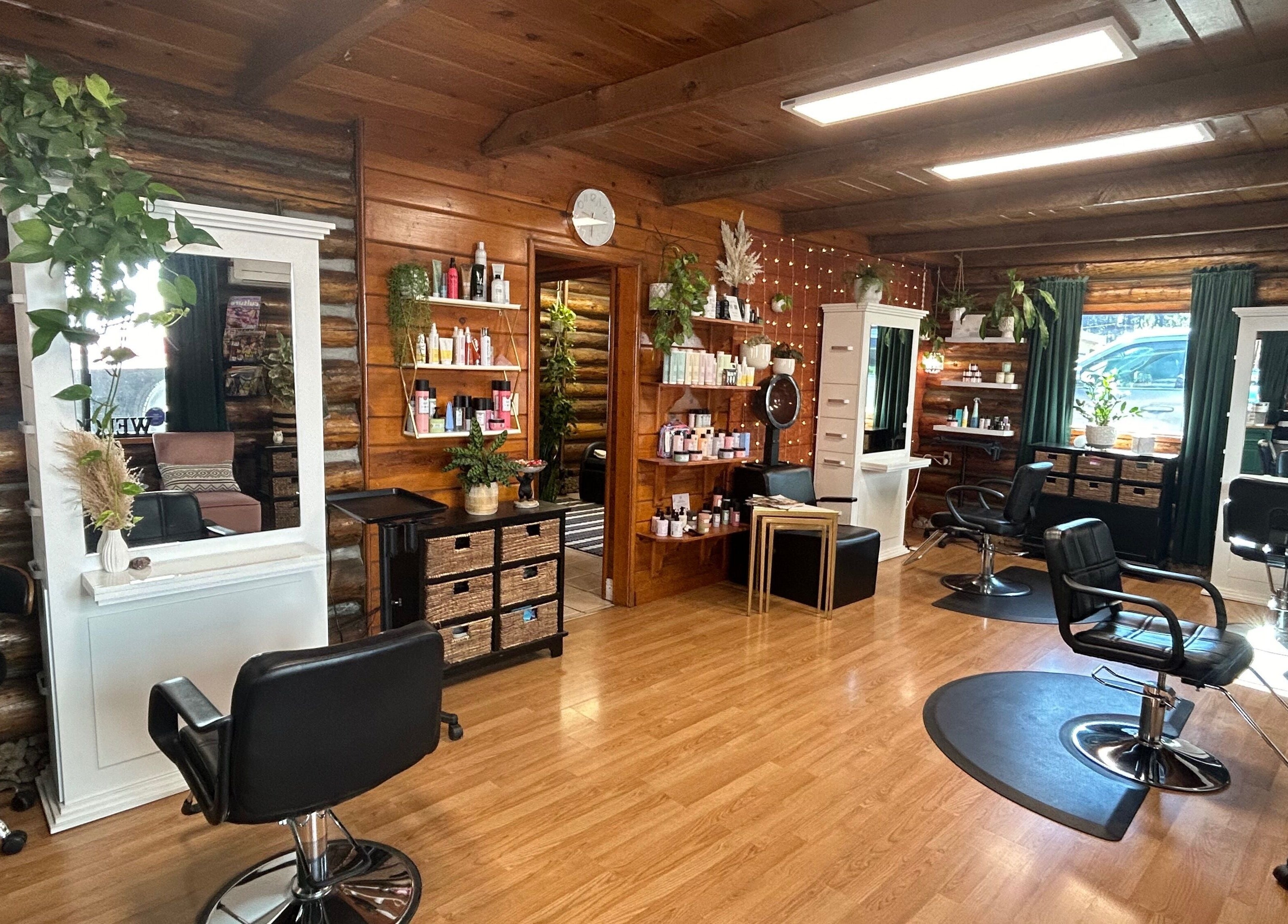 Interior of Emerald Grove Salon featuring elegant styling chairs and wooden accents in South Lake Tahoe, California, US.