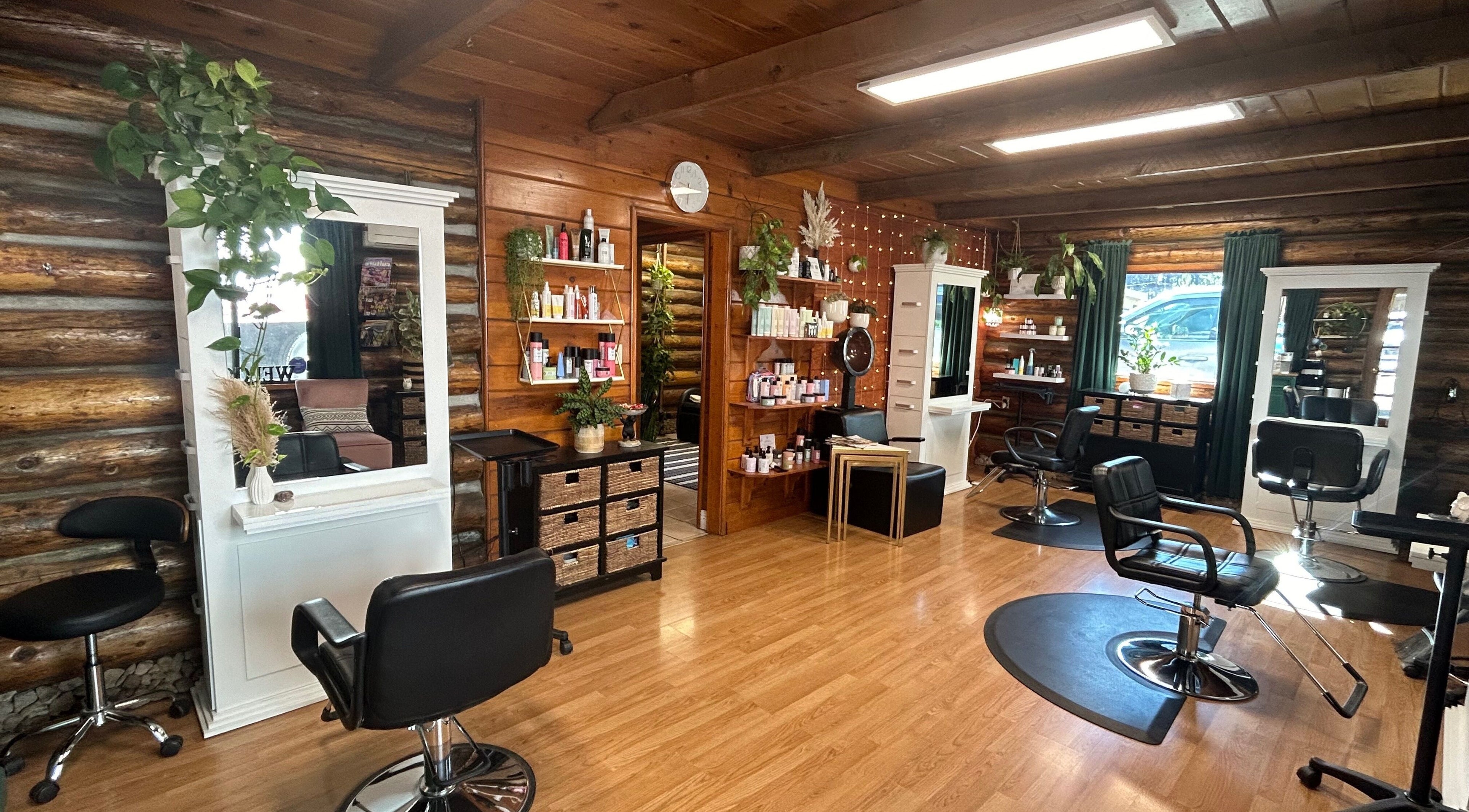 Interior of Emerald Grove Salon featuring elegant styling chairs and wooden accents in South Lake Tahoe, California, US.