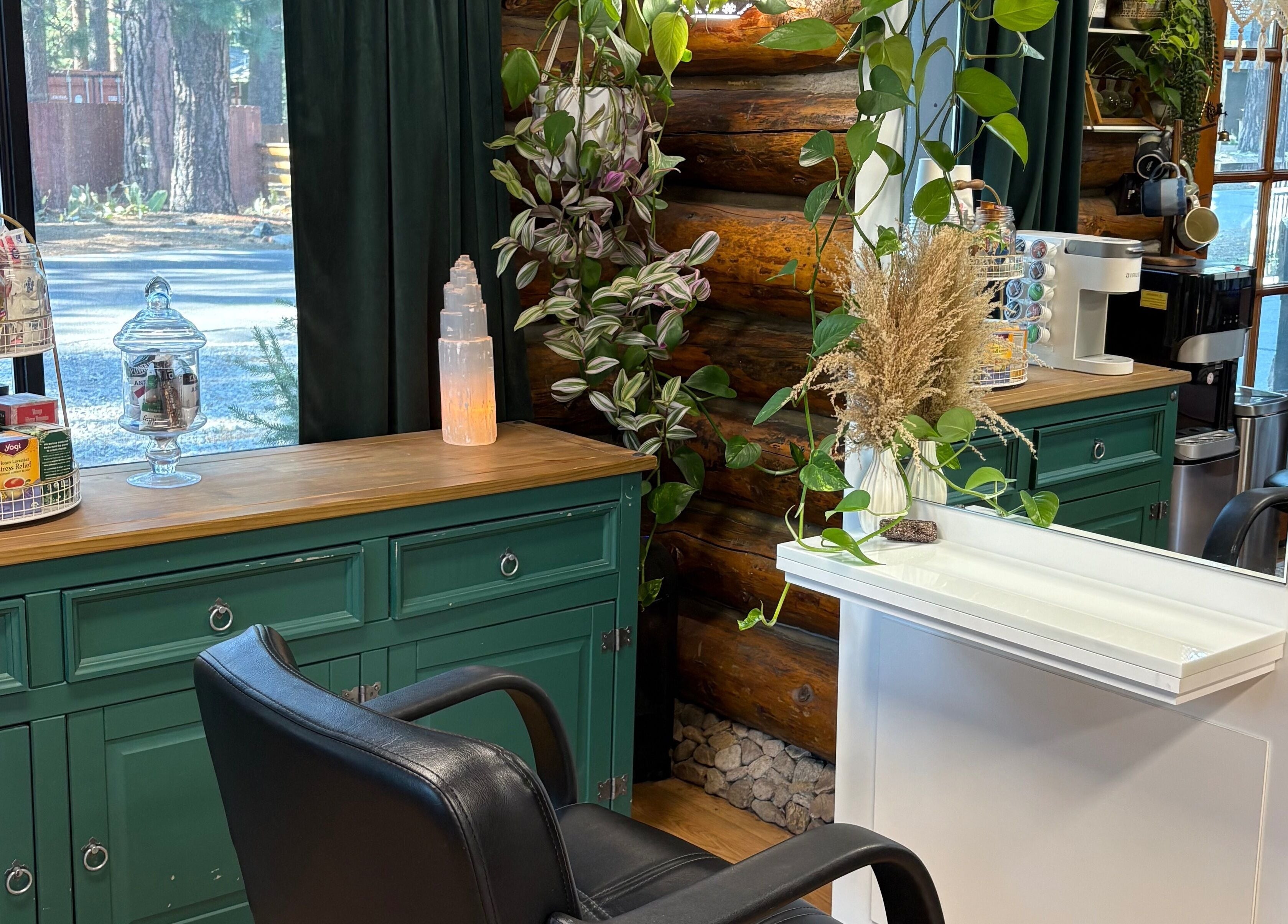 Stylish corner at Emerald Grove Salon in South Lake Tahoe, California, featuring chic decor and natural light.