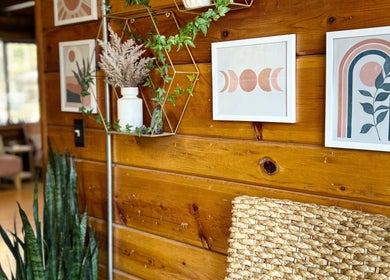 Trendy wall art and greenery at Emerald Grove Salon in South Lake Tahoe, California, US.