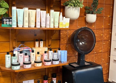 Emerald Grove Salon hair products shelf at South Lake Tahoe, California, US with relaxing ambiance.