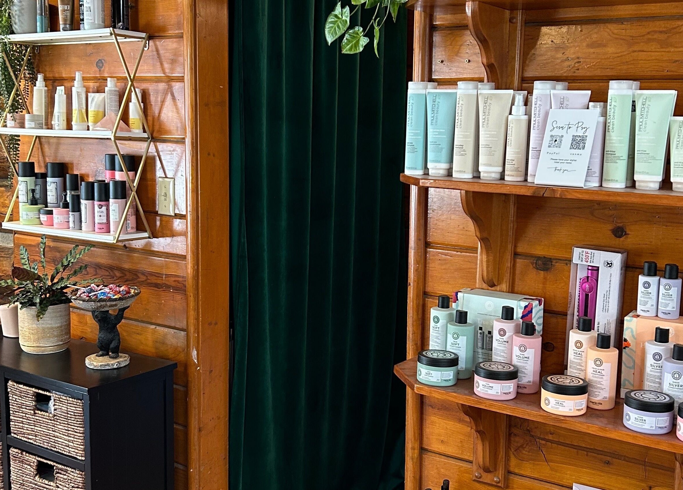 Product shelves at Emerald Grove Salon in South Lake Tahoe, California, US, showcasing beauty essentials.