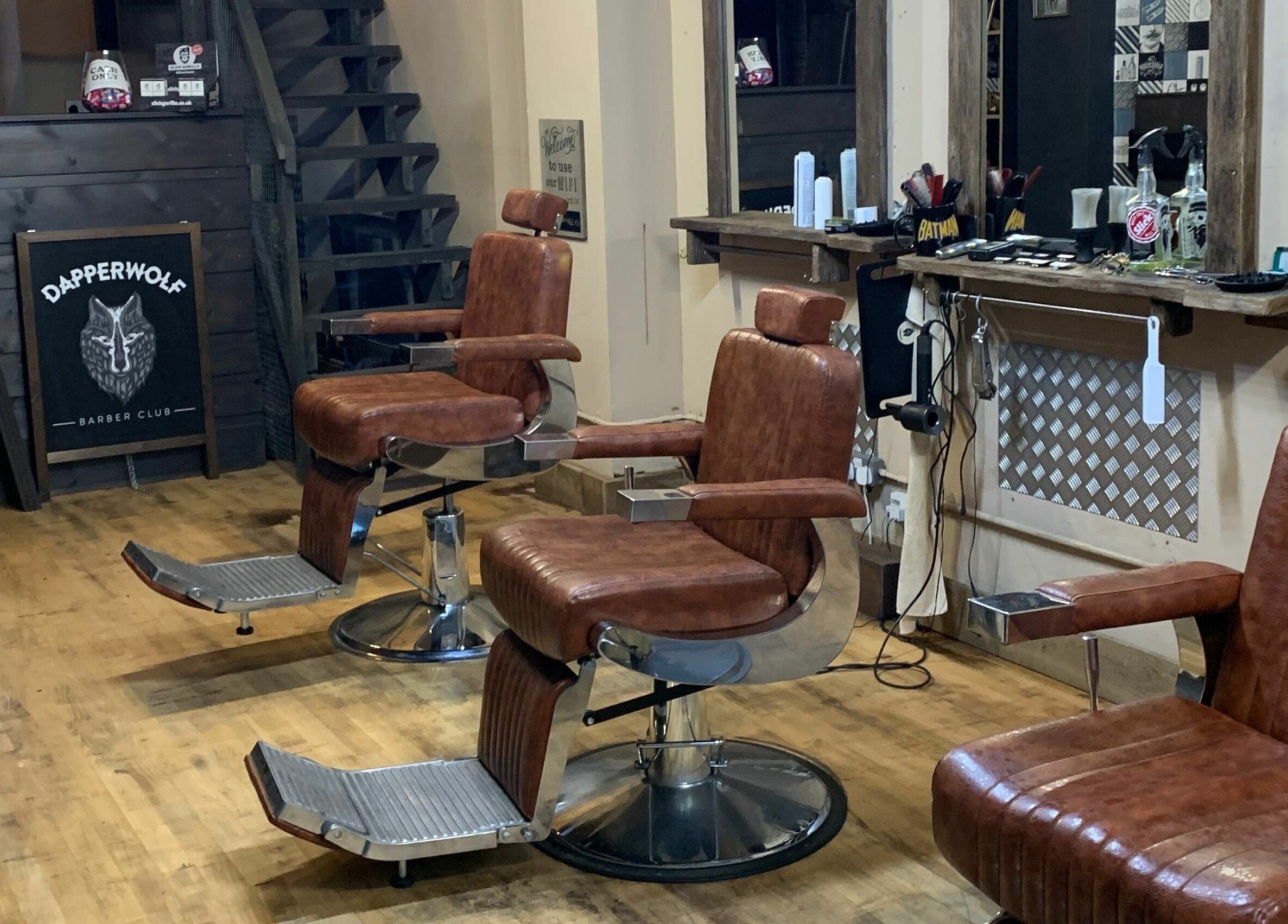 Classic barber chairs at Dapperwolf, a stylish barbershop in Glasgow, Scotland, GB.