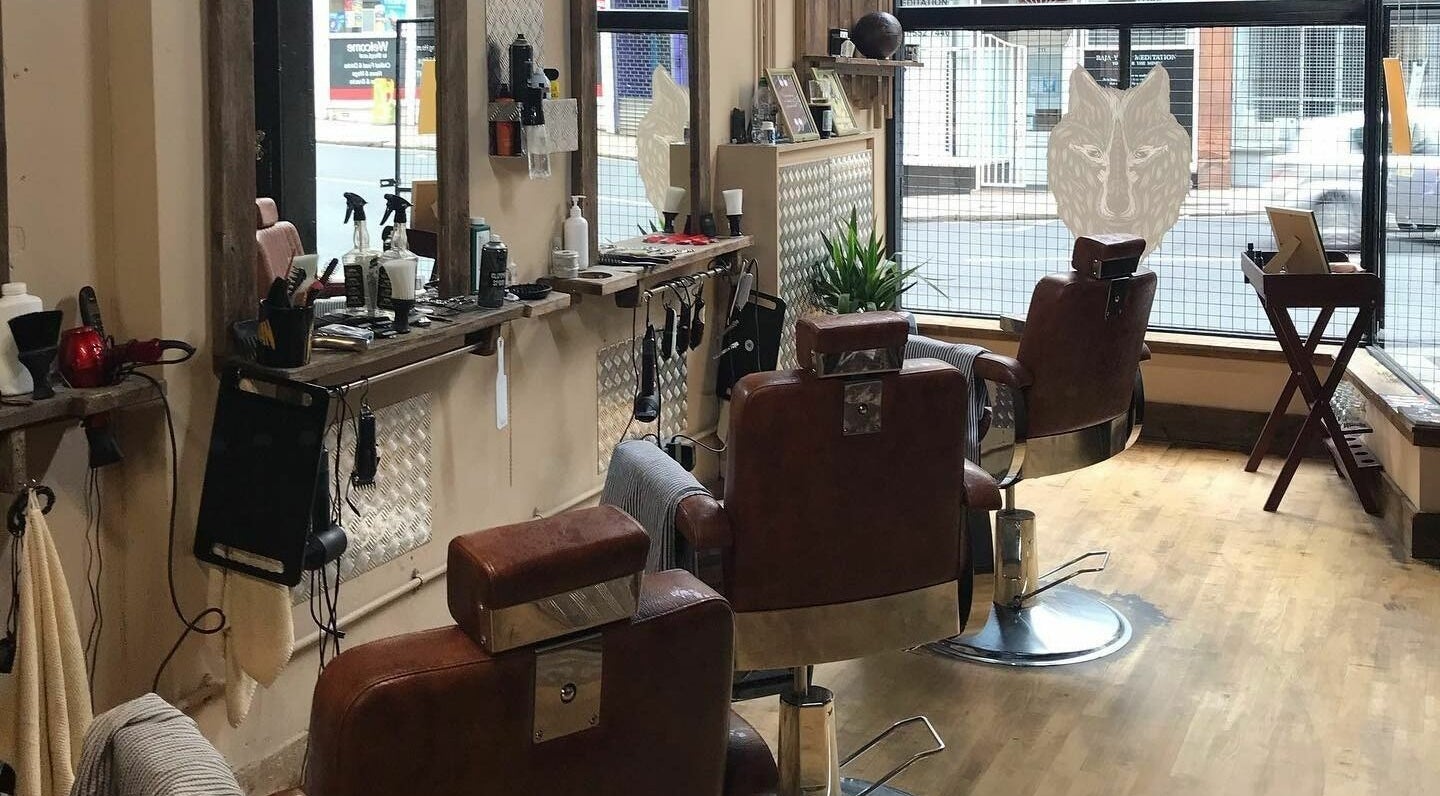 Chic barber chairs at Dapperwolf, Glasgow, Scotland, GB showcasing a modern beauty setting.