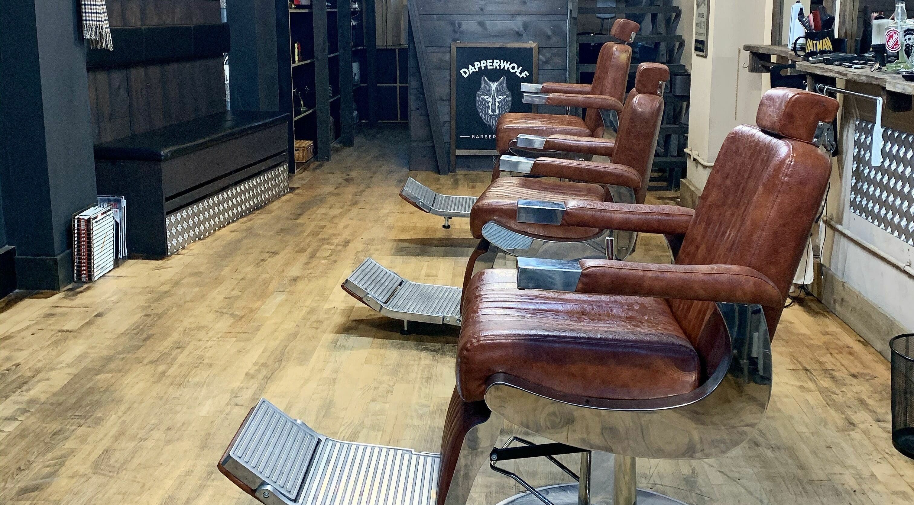 Vintage-style leather chairs at Dapperwolf, Glasgow, Scotland, GB, showcasing a classy barber setup.