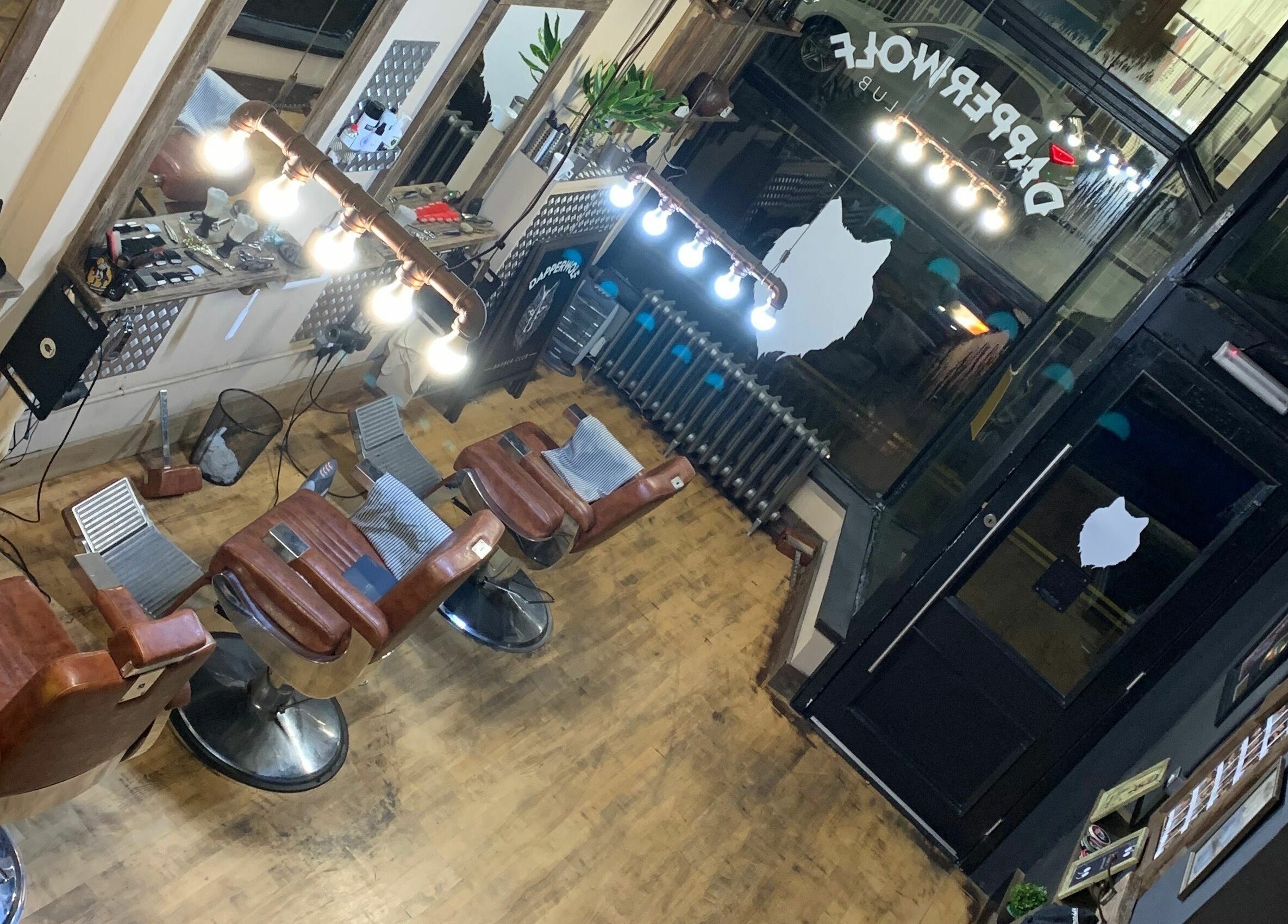 Dapperwolf's stylish interior with grooming chairs in Glasgow, Scotland, GB. Modern and inviting barbershop.