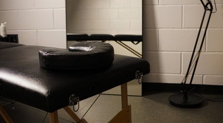 Massage table in tranquil room at Grounded Performance, Livingston, Scotland, GB, ideal for wellness sessions.