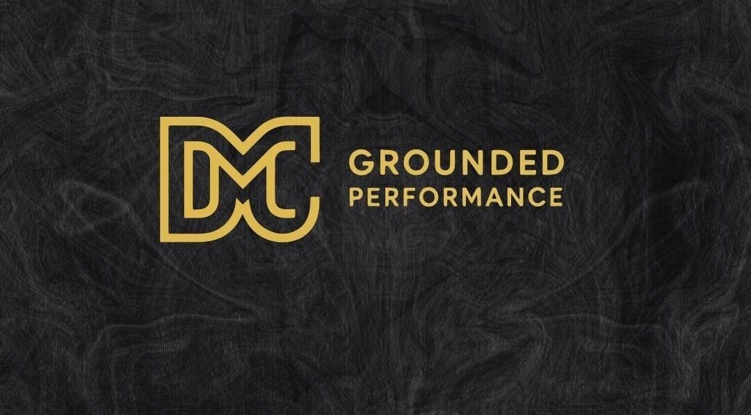 Logo of Grounded Performance, Livingston, Scotland, GB in gold on a textured black background.