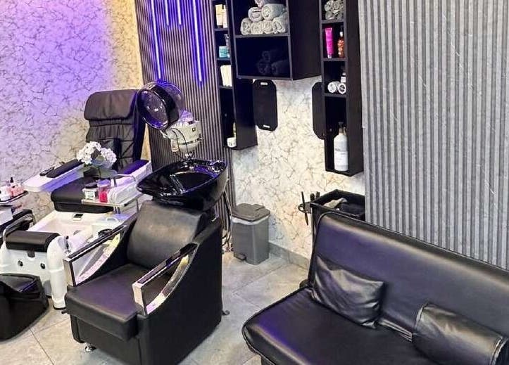 Sophisticated interior of M&M Gents Salon, Dubai, Dubai, AE, featuring plush seating and modern salon equipment.