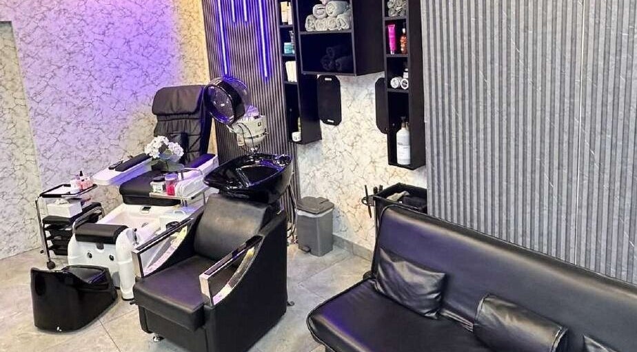 Sophisticated interior of M&M Gents Salon, Dubai, Dubai, AE, featuring plush seating and modern salon equipment.