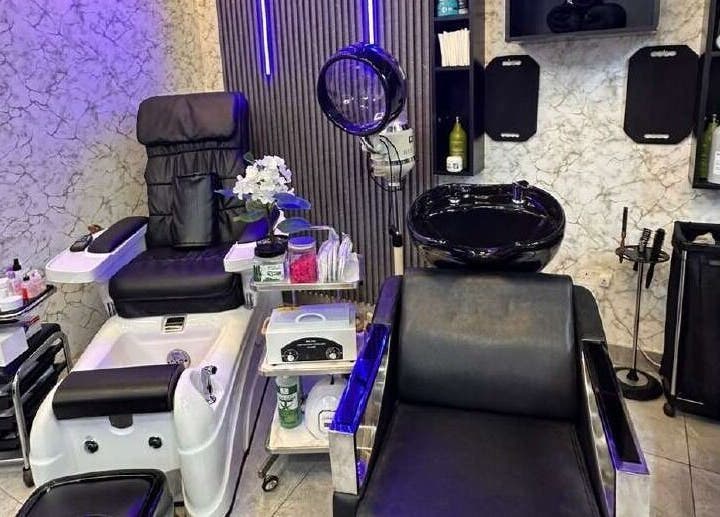 Elegant interior of M&M Gents Salon in Dubai, Dubai, AE with stylish barber chairs and modern decor.