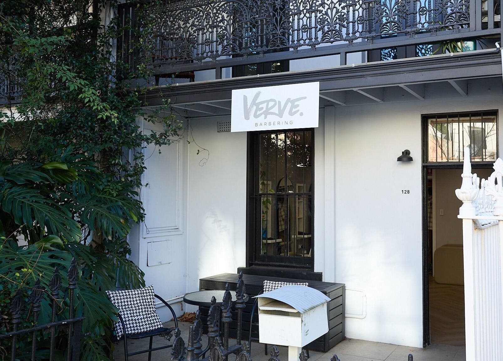 Verve Barbering - Surry Hills entrance with lush greenery on a quiet street in Surry Hills, New South Wales, AU.