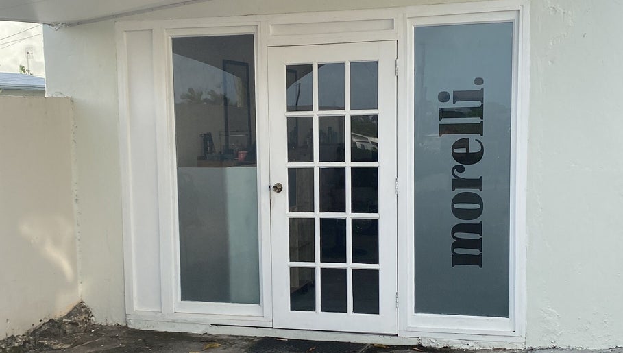 Chic entrance to morelli. beauty venue in Bridgetown, Saint Michael, BB with sophisticated glass doors.