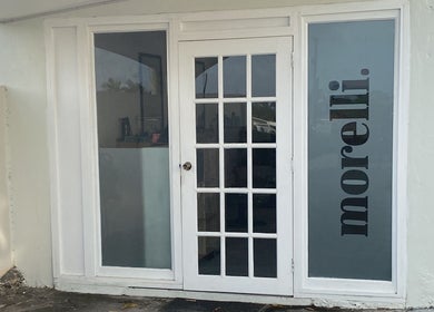 Chic entrance to morelli. beauty venue in Bridgetown, Saint Michael, BB with sophisticated glass doors.