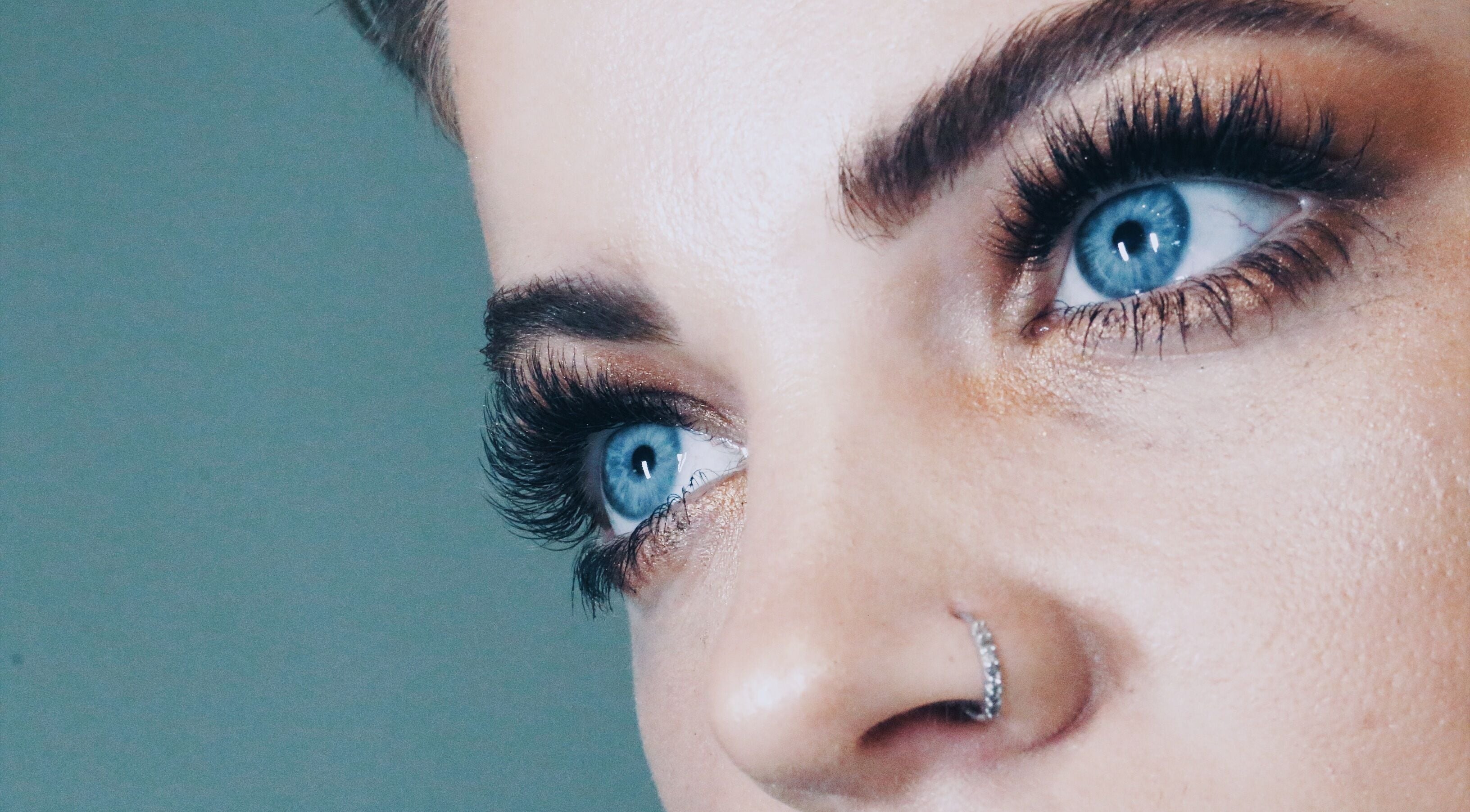 Close-up of blue eyes with lush lashes at Lash Library, Huntsville, Alabama, US.