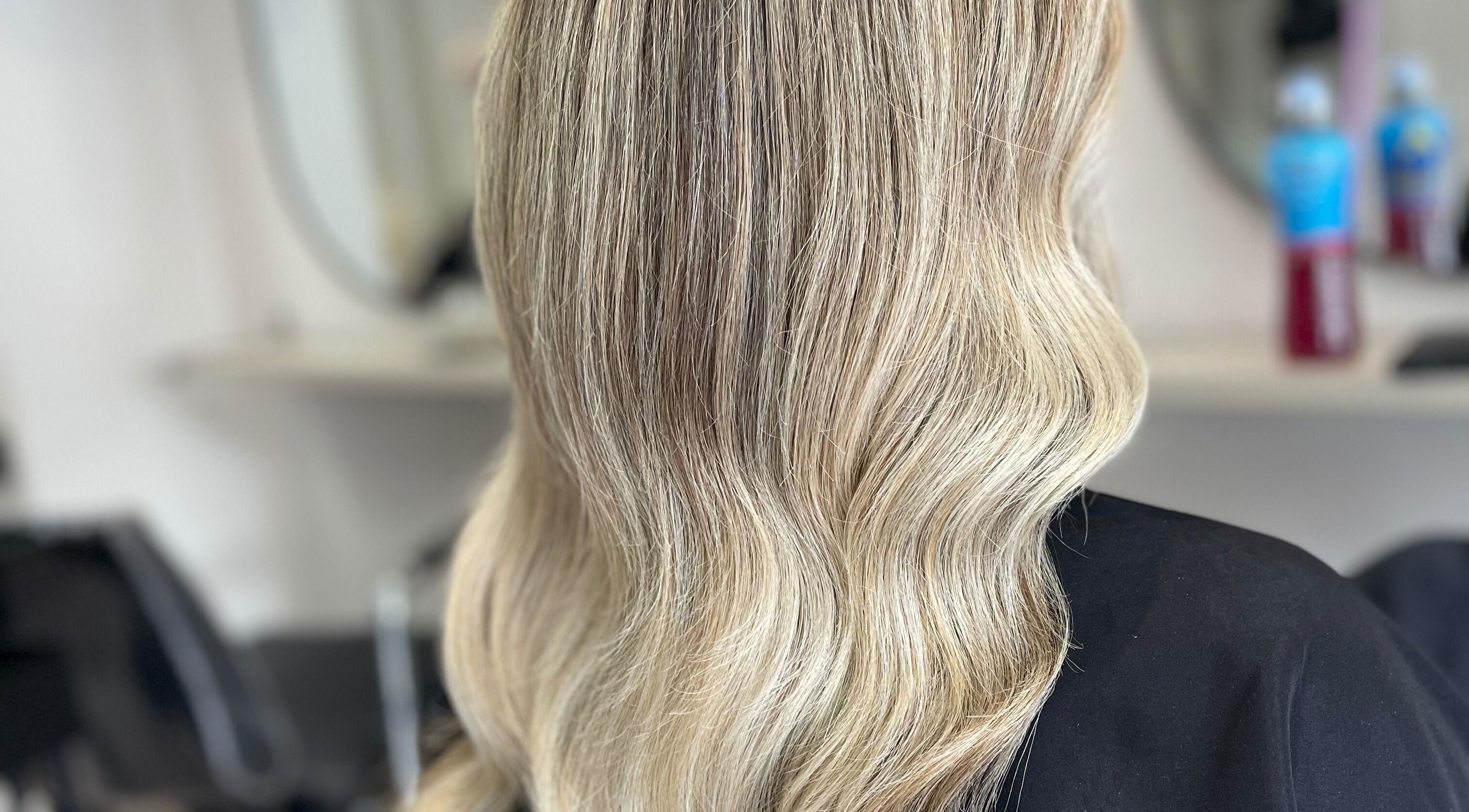 Elegant blonde waves styled by Gigi - Hair Colourist in Telford, England, GB, showcasing expert color techniques.