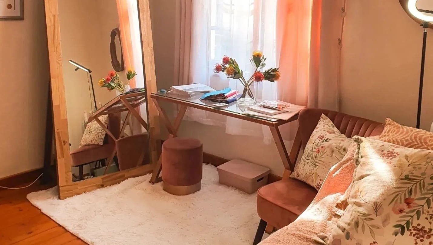 Elegant corner with mirror and plush sofa at Nika Beauty and Nail Studio, Lydenburg, Mpumalanga, ZA.