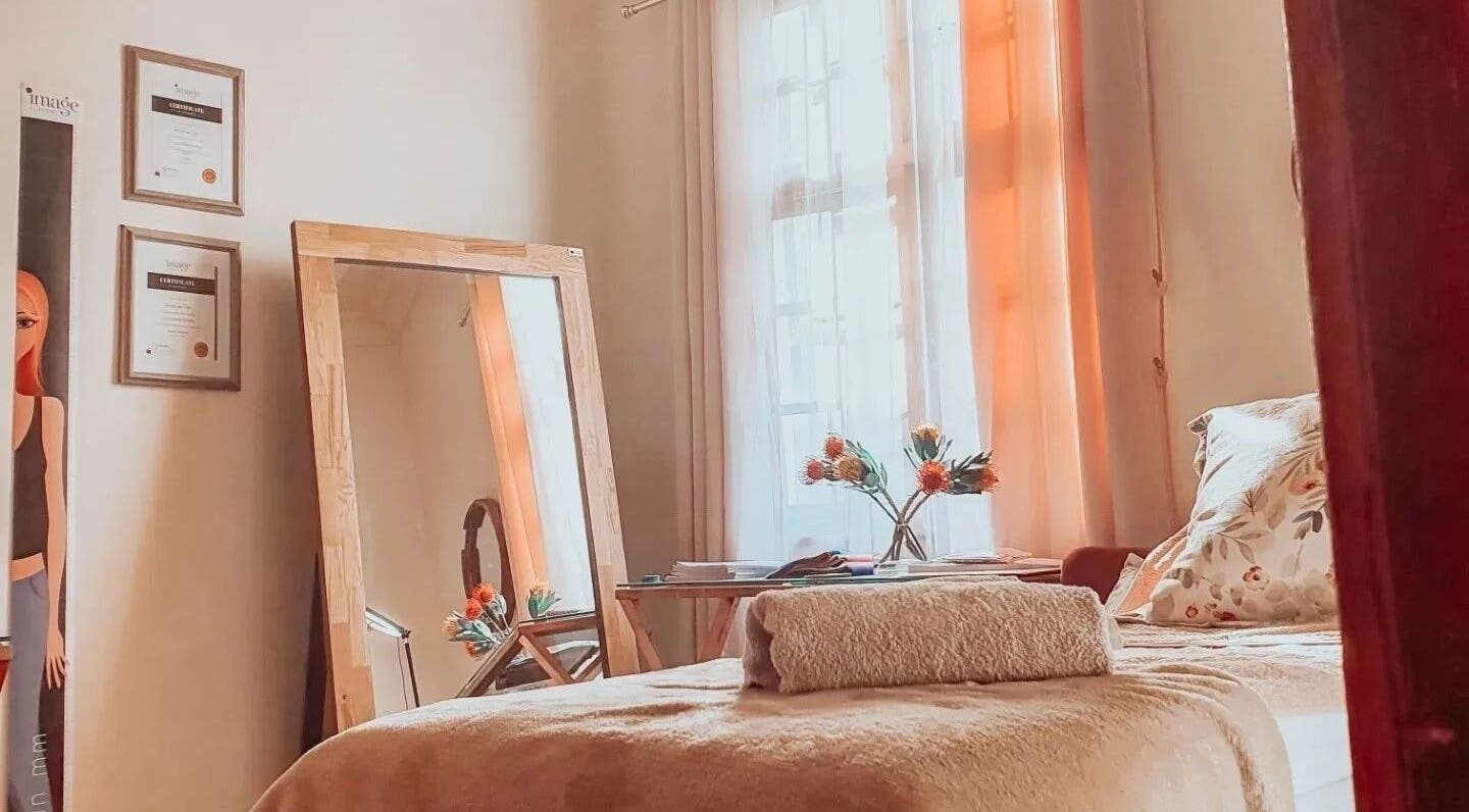 Relaxing room at Nika Beauty and Nail Studio, Lydenburg, Mpumalanga, ZA with floral decor and soft lighting.