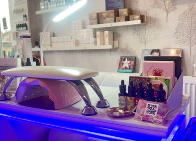 Modern nail station at MKM Beauty, Lancaster, England, GB, featuring manicure tools and products on display.