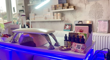 Modern nail station at MKM Beauty, Lancaster, England, GB, featuring manicure tools and products on display.