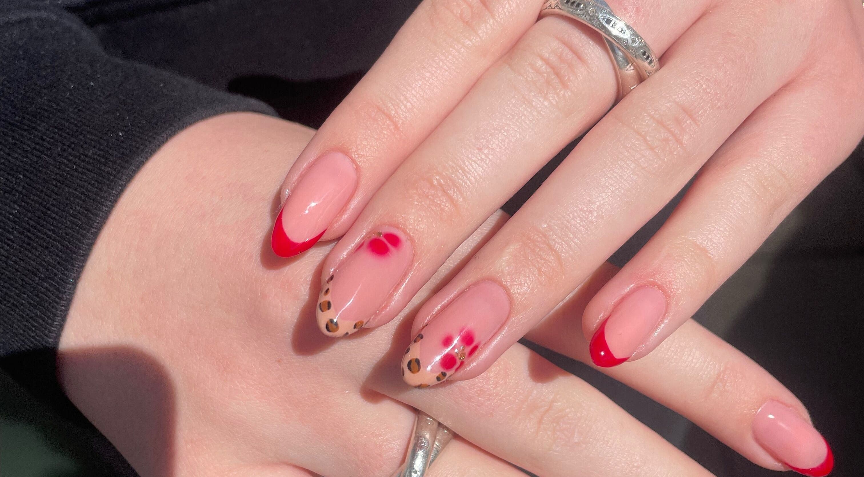 Stylish nail art with red tips at Nails by Amy, Wirral, England, GB. Perfect for a chic and modern look.