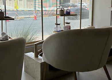 Relaxing seating at Golden Beauty Care Center, overlooking الشارقة, Sharjah, AE street view.