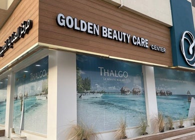 Golden Beauty Care Center facade in Sharjah, AE, showcasing modern design with inviting display.
