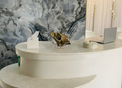 Golden Beauty Care Center reception with marble decor, Sharjah, AE.