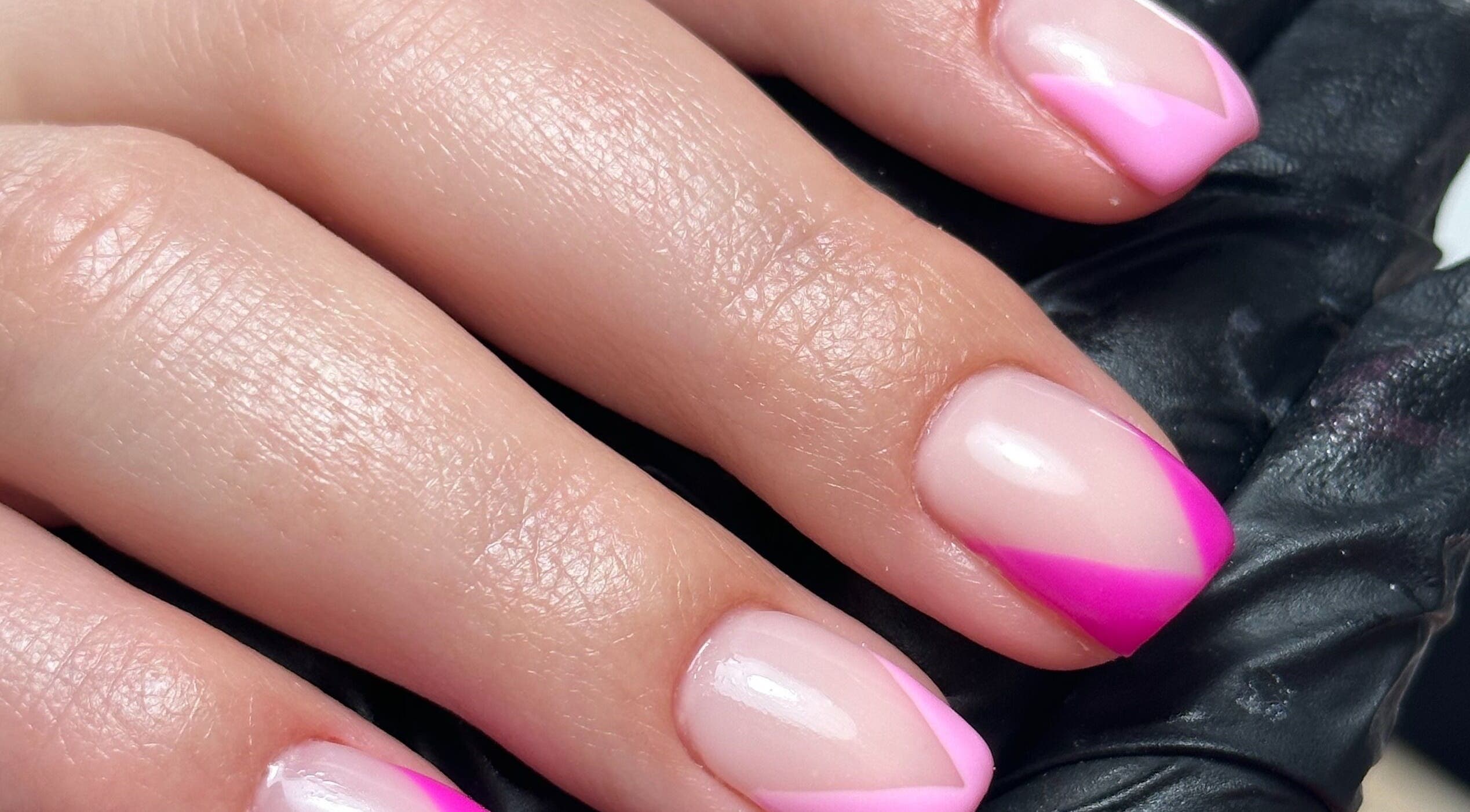 Pink nail art design at The Cure, Stockport, England, GB showcasing vibrant creativity and style.