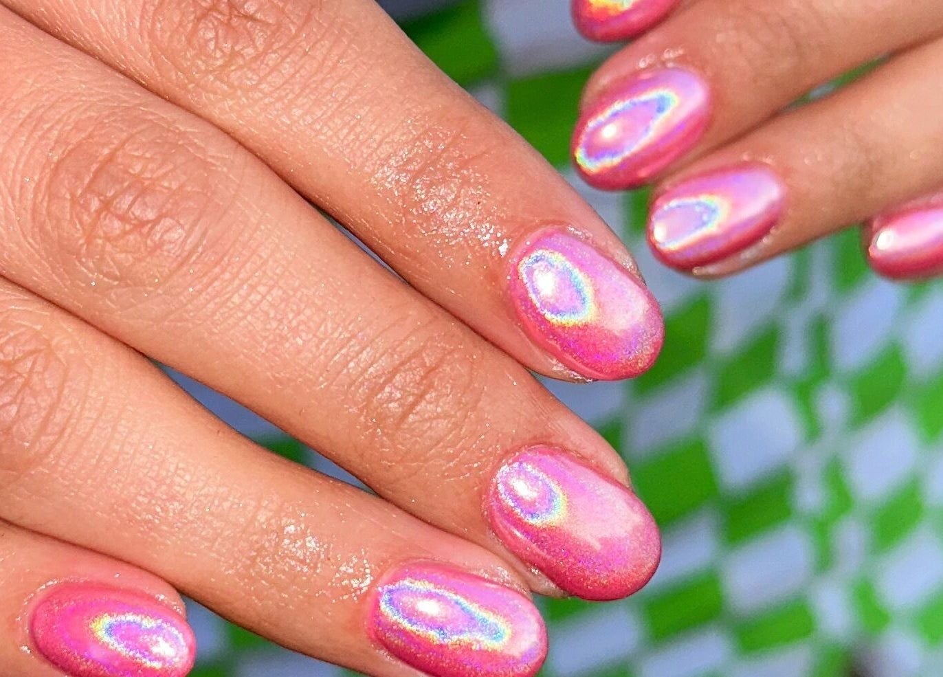 Holographic pink manicure at The Cure, Stockport, England, GB, showcasing a stylish and vibrant nail design.