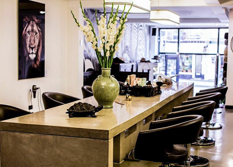 Chic interior of Bubblekid salon in Amsterdam, Noord-Holland, NL with modern decor and seating.