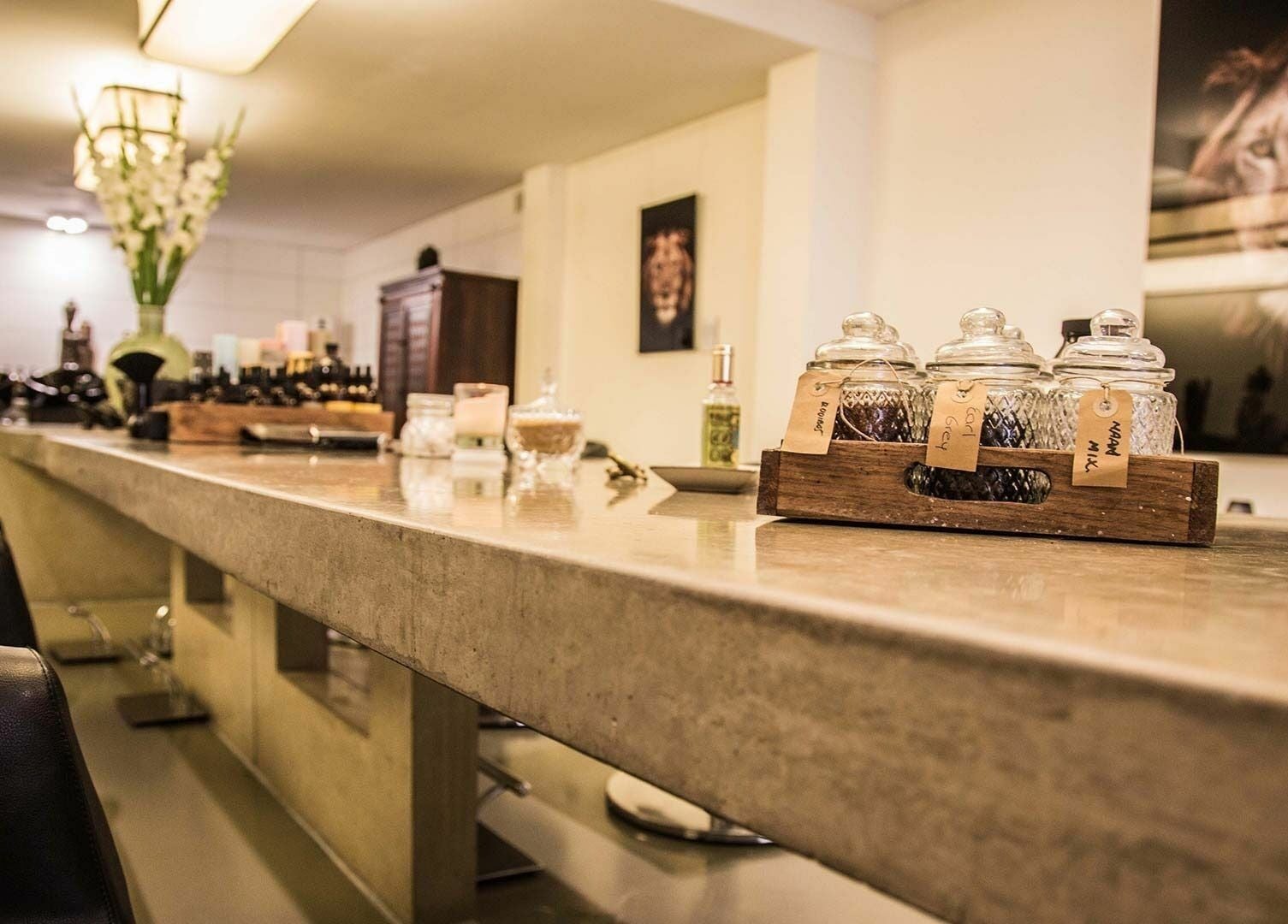 Elegant interior of Bubblekid in Amsterdam, Noord-Holland, NL with decorative jars and vibrant flowers.