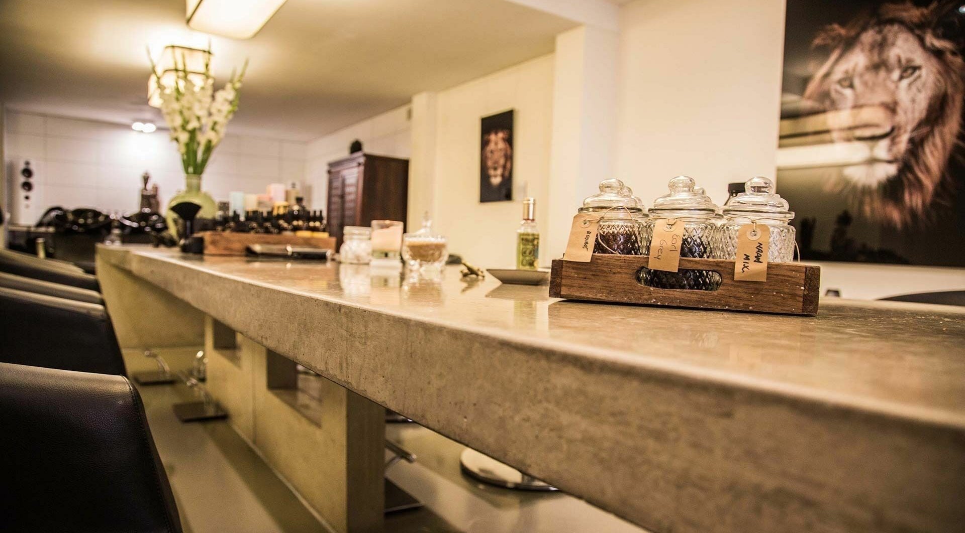 Elegant interior of Bubblekid in Amsterdam, Noord-Holland, NL with decorative jars and vibrant flowers.