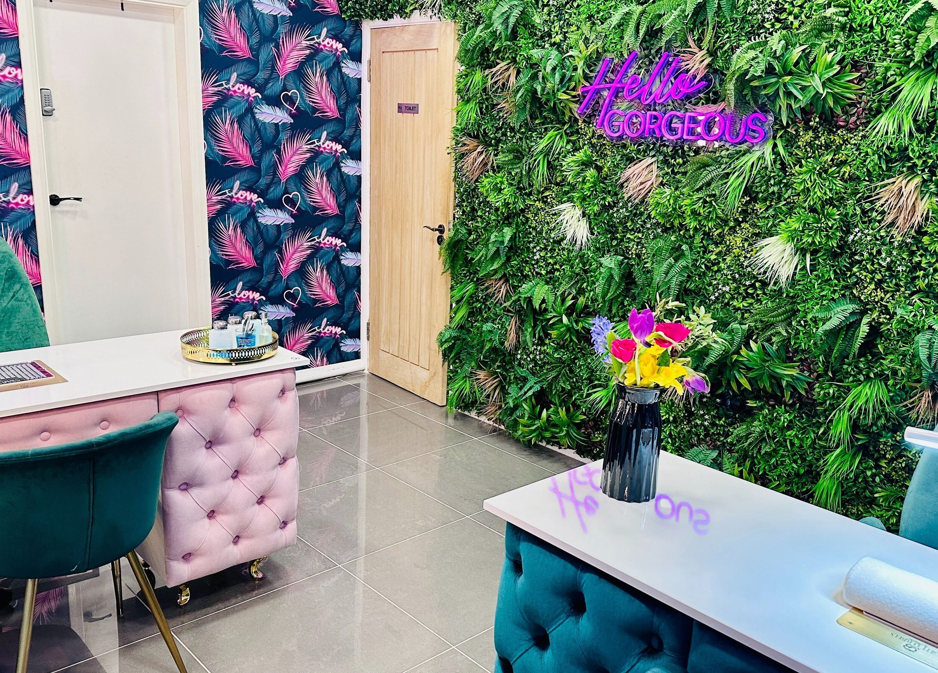 Beauty Unleashed Multi Award Winning Hair and Beauty salon in Edinburgh, Scotland, GB. Chic interior with green wall.