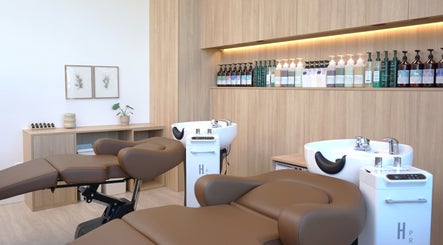 Relaxing wash stations at Forme Hair Salon & Head Spa in Vancouver, British Columbia, CA, showcasing luxury.